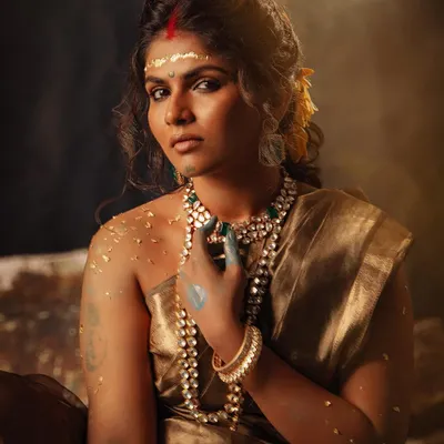 From my conceptual shoot "सुवर्ण कांता" (Golden Grace). This look blends a simple golden tissue saree with raw, earthy elements to tell a story of a strong, empowered woman.