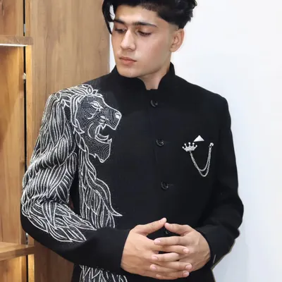 This is what I call wearable art. A custom black Jodhpuri jacket featuring a hand-embroidered roaring lion design, crafted to make a bold and unforgettable statement.