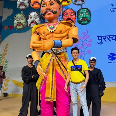 Posing with the 12-foot Ravan puppet my team and I created for the Paani Foundation's Farmer Cup. This puppet, with its ten heads representing ten farming issues, was the centerpiece of a powerful dance drama.