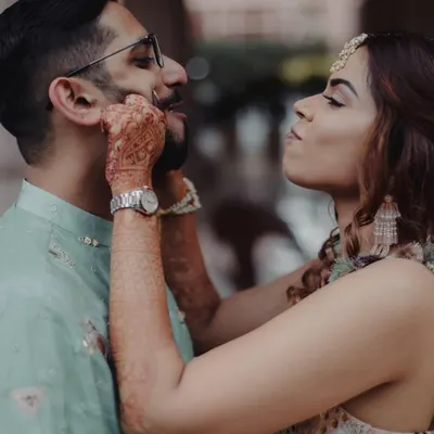 A playful, candid moment between the bride and groom. These are the small, unposed interactions that truly capture a couple's unique love story.
