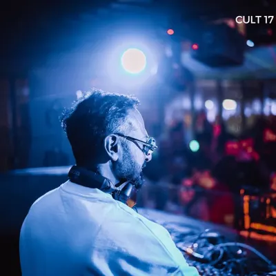 A DJ looks out over the crowd from the booth at High Ultra Lounge. I produce regular club nights at Bangalore's most premium rooftop venue, featuring top-tier artists.