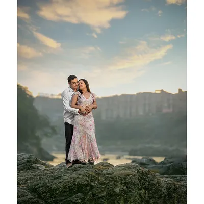 Standing on a cliff, wrapped in each other's arms as the sun sets over Rishikesh. This is the kind of epic, breathtaking shot that you'll want to frame on your wall.