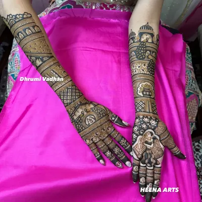 A complete bridal mehendi look, featuring a couple portrait, initials, and traditional Rajasthani architectural motifs.