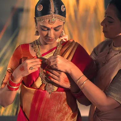 A close-up on the bride from the Kanakavalli 'Little Rituals' campaign. The styling focused on authentic South Indian bridal adornment, from the temple jewelry to the intricate details on the Kanjivaram saree.