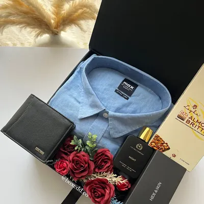 Even classic gifts for men like a shirt, wallet, and belt can be elevated when presented in a beautifully curated hamper like this one.