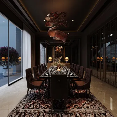 This design for a sculptural dining area is all about creating a moody and immersive atmosphere. We layered dramatic lighting, a textured carpet, and a striking dining table to craft a space that feels unapologetically luxurious and rich with intention.
