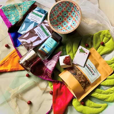 This festive hamper was a custom creation for a corporate client, and it’s a great example of what we do. We curated a selection of mindfully sourced food items, a hand-poured soy candle, a beautiful mango wood bowl, and unique upcycled fabric bunting. The colors were chosen to feel celebratory for any festival, making it a versatile and thoughtful corporate gift.
