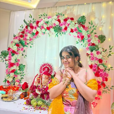 We loved creating this Ganesh Chaturthi backdrop for our client. The floral arch of pink and white roses perfectly frames the idol and brings so much joy to the home celebration.