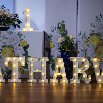 Make your event unique with personalized marquee letters. These light-up letters spelling "ATHARV" were part of a blue Moroccan theme, adding a beautiful, warm glow to the decor.