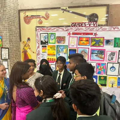I love interacting with students during art exhibitions. Here I am at the AECS Magnolia Maruti Public School, discussing the artworks with the talented young artists who created them.