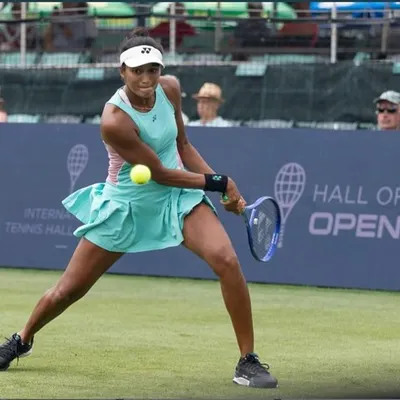 Hitting a forehand during my first WTA 125 win on a grass court. Adapting to a new surface is a challenge that tests both physical conditioning and mental toughness.