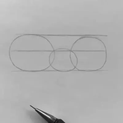 Step 1: A tutorial on how to structure a face for a portrait. I start with basic circles to map out the placement of the eyes and nose, creating a solid foundation.