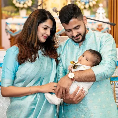 A beautiful family portrait during a baby's naming ceremony or baptism. We respectfully document these important religious and cultural traditions.