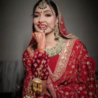 The best Punjabi bride. Her happy, playful pose and beautiful smile perfectly capture the joyful spirit of a Punjabi wedding.