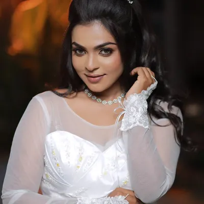 A signature celebrity-inspired look for a Christian wedding. The makeup is elegant and enhances her natural beauty, with soft eyes and a neutral lip, perfect for a white gown.