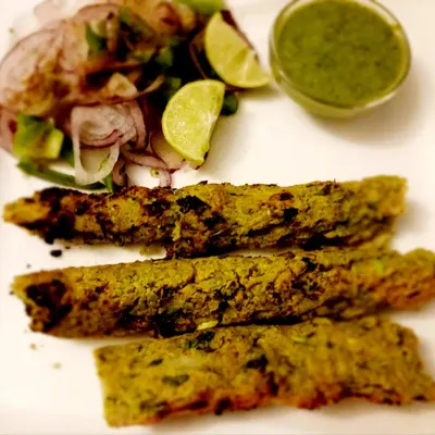 Ponk Seekh Kebabs, a unique winter delicacy from Gujarat made from tender roasted sorghum. This dish showcases my expertise in using seasonal and regional ingredients to create novel menu items that attract curious foodies. These kebabs are oil-free, flavourful, and a true taste of tradition.