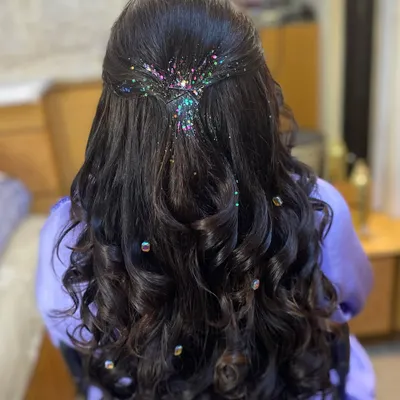 Let your hair do the talking with this sparkling glitter hairdo. I love adding a touch of multi-colored glitter to a half-up style for a fun and festive look, perfect for a sangeet or cocktail party.