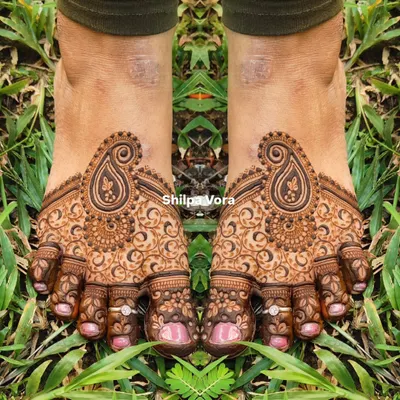 A beautiful paisley design for the feet, with intricate swirls and details covering the toes and top of the foot.