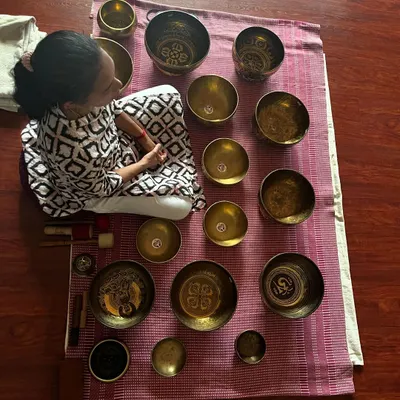 This is my sanctuary of sound. I use a collection of Tibetan singing bowls, each with a unique frequency, to create an immersive sound bath. This practice is a profound experience of rest and healing, helping you connect with the silence within.