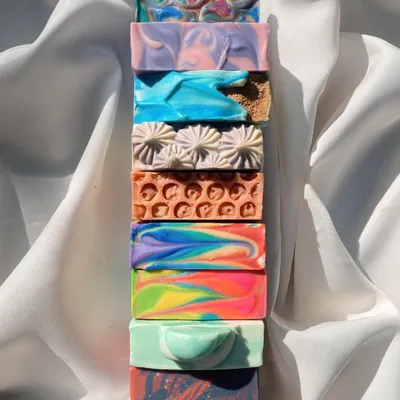 A stack of my beautiful, handcrafted soaps from our first collection of 2023. Each one tells a different story with its colors and patterns.