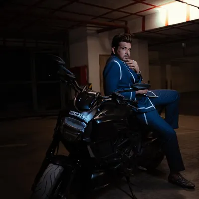 A different angle of Karan Kundrra's custom suit for the Indian Telly Awards. This pose highlights the sharp tailoring and the unique, open-collar styling.