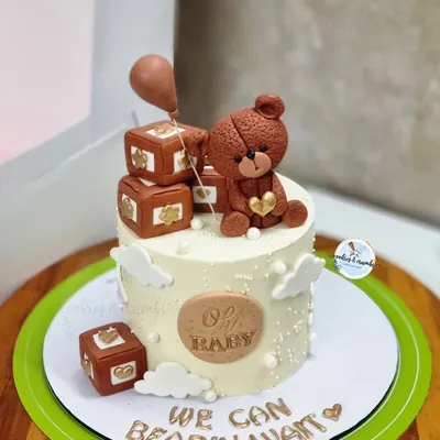 "We can bearly wait!" This adorable teddy bear cake is a favorite for baby showers. It features a hand-sculpted fondant bear, tiny blocks, and a sweet message for the parents-to-be.