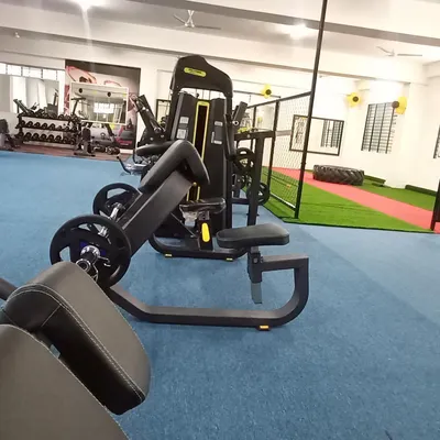 A look at some of our specialized strength equipment, including a preacher curl bench for focused arm workouts. We have the right tools for every muscle group.