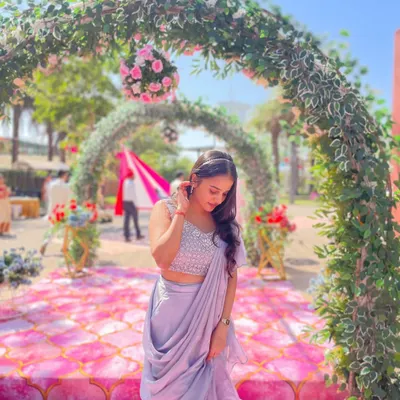 This lavender ready-to-wear saree looks stunning against a beautiful floral backdrop. It’s the perfect rental for a daytime wedding or garden party, offering elegance without effort.