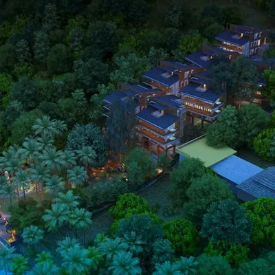 This aerial view captures the essence of the Atmanya resort in Goa, where individual villas are nestled within dense tropical foliage along the river, offering guests both privacy and a deep connection to nature.
