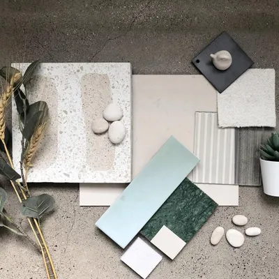 This is the material palette we developed for the 'Crème' wellness project. We curated a selection of terrazzo, marble, textured tiles, and soft fabrics in a soothing, earthy color scheme to establish the project's core aesthetic of soft, blended surfaces.