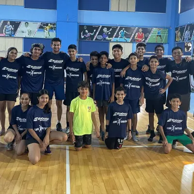 The graduating batch of our 2023 kids' badminton summer camp. Everyone is seen here in their official camp t-shirts, part of the gear every participant receives.