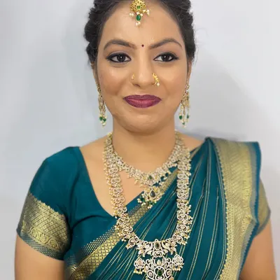 A beautiful client ready for her event. This look features soft, defined eyes with a hint of shimmer and a deep berry lip, paired with elegant diamond jewelry.