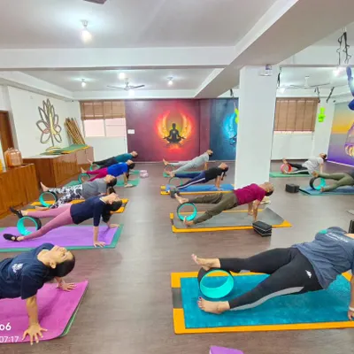A full class using yoga wheels to deepen their backbends in unison. Props allow everyone to access poses safely and effectively.