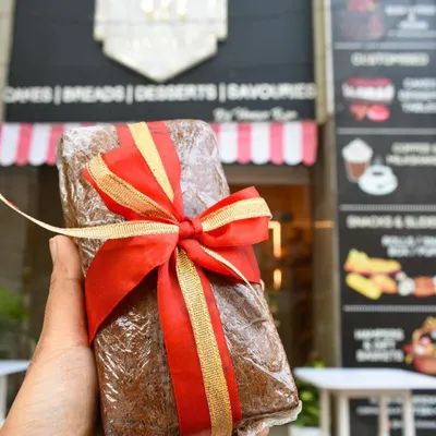 It's the first of December, which means it's officially Christmas season at the bakery! Here's a beautifully wrapped plum cake, ready for gifting.