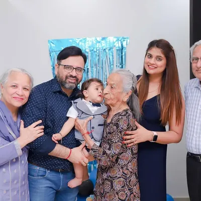 Four generations in one photo. A great-grandmother's kiss is a priceless memory we were honored to capture for this family.