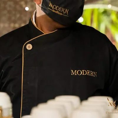 Our signature black and gold uniform. We believe a professional appearance is the first step in delivering professional service. The 'Modern' branding is a mark of our quality.