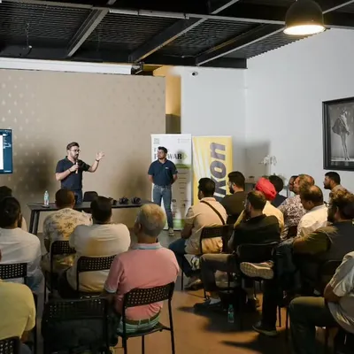 During a workshop with Nikon, I'm explaining a lighting concept on screen. I make sure to break down complex topics step by step, ensuring everyone in the room, regardless of their skill level, can follow along and learn.