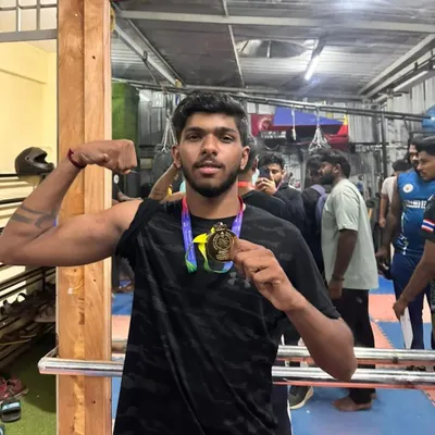 One of our boxers showing off his hard earned gold medal from the 2024 Bengaluru University Inter-college sports competition. The flex is well deserved.