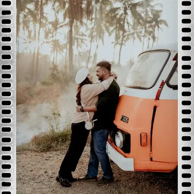 A romantic embrace against a vintage camper van. This shot perfectly captures the adventurous, free-spirited vibe of a road trip-themed pre-wedding shoot.