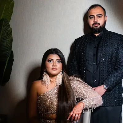 A power couple ready for their reception. For the bride, we did a full glam look with dramatic eyes and sleek hair to match her stunning, modern gown.