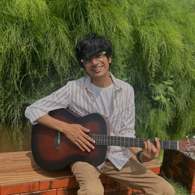 Just me, my guitar, and some nice green vibes. This is when I feel most at peace, creating music surrounded by nature.