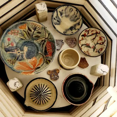 The big reveal. A top-down view inside my kiln, filled with an array of beautifully painted and glazed pieces ready to be taken home by their creators.
