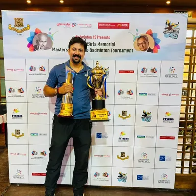 A great thrill to win a double crown at the GD Birla Interclub Badminton Tournament at Bombay Gymkhana, holding trophies for the Men's Doubles 45+ and Men's Doubles 85+ categories.