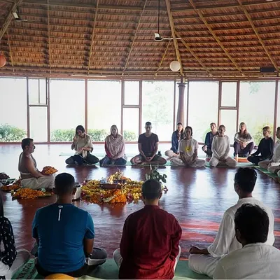 Students and teachers gather for the opening Puja ceremony of a new teacher training. This traditional ritual, filled with mantras and offerings, creates a sacred and unified atmosphere for the month of learning ahead.