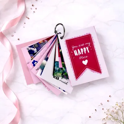 A little bundle of your happiest memories. This mini tag photo album holds 9 of your favorite photos and can be customized to any theme. It's a compact and emotional keepsake.