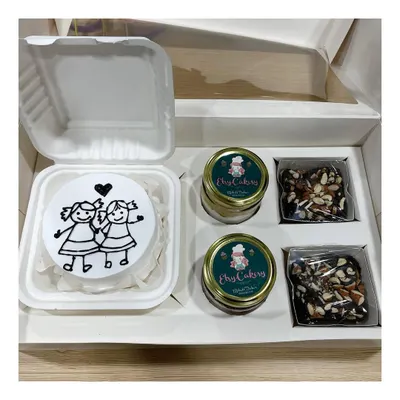 A look inside one of my custom hamper boxes. This one includes a personalized bento cake, two decadent cake jars, and two of my signature almond brownies.