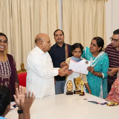A truly proud moment as one of our young dancers receives a certificate of appreciation from the Honorable Governor of Karnataka, Shri Thawar Chand Gehlot. This recognition highlights the incredible dedication of our students.