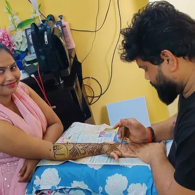 A candid moment applying mehndi for a client at her home. I always ensure my clients are comfortable during the application process.