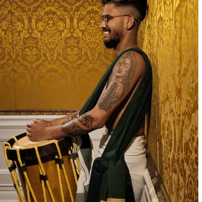 A modern artist with a traditional soul. Our member showcasing his tattoos and his love for the chenda.