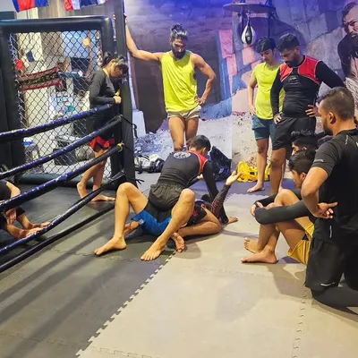 Muscle memory is key in grappling. Here, our fighters are drilling BJJ techniques, learning to execute moves instinctively until they become second nature.